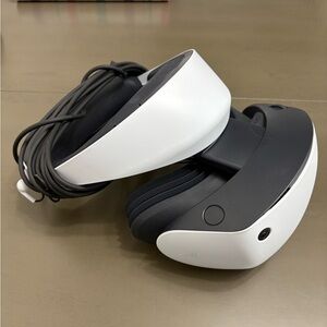 Sony White and Black VR Headset with Attached Cable and Controllers